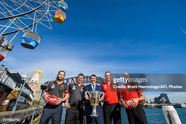 Callan Ward, Leon Cameron, Premier of NSW Mike Baird, John Longmire and Jarrad McVeigh pose for a photo with the 2016 AFL Premiership Cup during an...