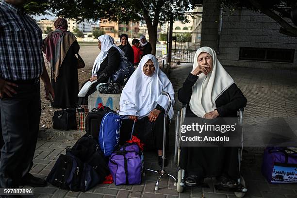Pilgrims wait for departure to the Holy city of Mecca from Gaza for making a pilgrimage, at Katibe Square in Gaza City, Gaza on August 30, 2016.