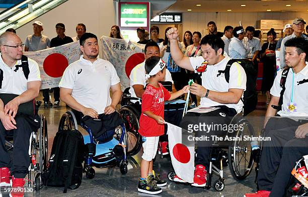 Members of the wheelchair basketball Japan team are seen off by families and fans on departure for Rio de Janeiro ahead of the Paralympic Games on...