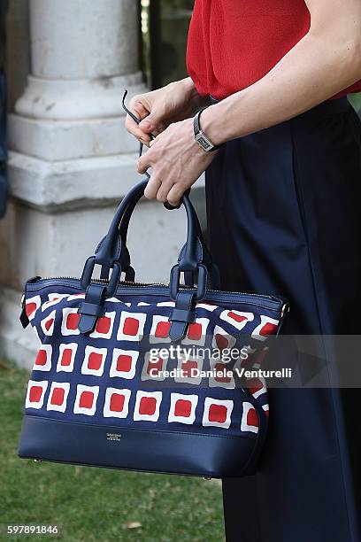 Festival hostess Sonia Bergamasco, bag detail, arrives at Lido during the 73rd Venice Film Festival on August 30, 2016 in Venice, Italy.