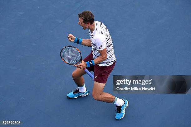 Vasek Pospisil of Canada celebrates after defeating Jozef Kovalik of Slovakia during his first round Men's Singles match on Day One of the 2016 US...