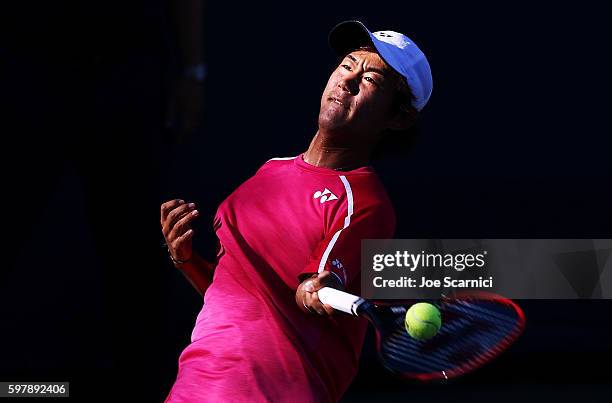 Yoshihito Nishioka of Japan returns a shot to Kevin Anderson of South Africa during his first round Men's Singles match on Day One of the 2016 US...