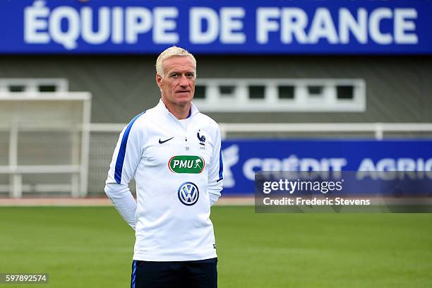 French Football Team head coach Didier Deschamps looks on as he takes part in a training session on August 29, 2016 in Clairefontaine, France. The...