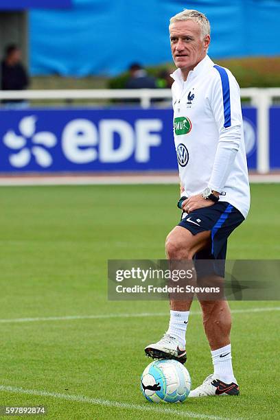 French Football Team head coach Didier Deschamps looks on as he takes part in training session on August 29, 2016 in Clairefontaine, France. The...