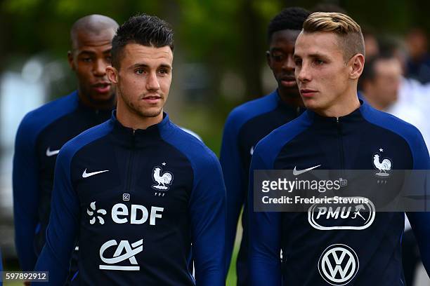 French Football Team defender Lucas Digne and defender Sebastien Corchia arrive a training session on August 29, 2016 in Clairefontaine, France. The...