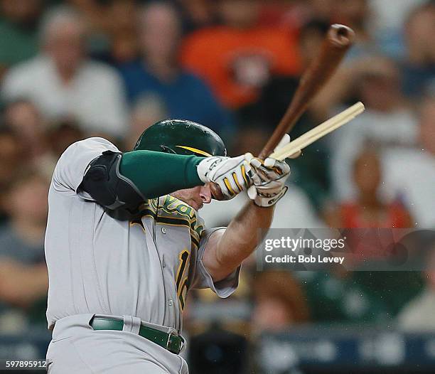 Max Muncy of the Oakland Athletics shatters his bat as he hits into a double play in the third inning against the Houston Astros at Minute Maid Park...