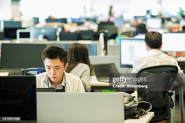 Employees work at the Garena Interactive Holding Ltd. Headquarters in Singapore, on Thursday, Aug. 25, 2016. Garena, a gaming and e-commerce empire...