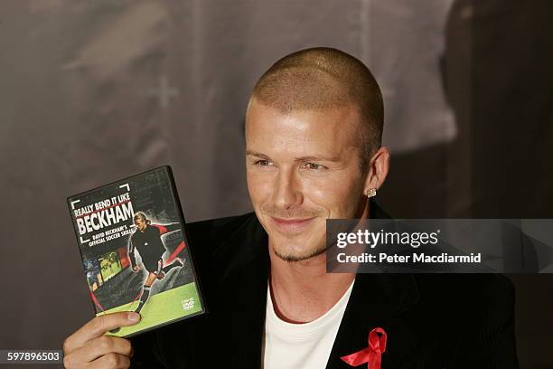 English footballer David Beckham signs copies of his DVD 'Really Bend it Like Beckham' in London, 1st December 2004.