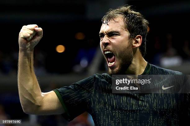 Jerzy Janowicz of Poland celebrates after winning the second set against Novak Djokovic of Serbia & Montenegro during his first round Men's Singles...