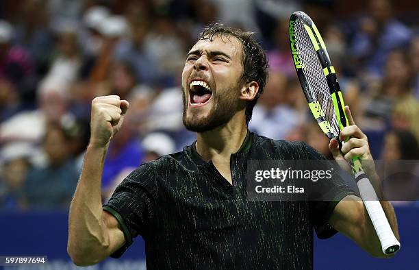 Jerzy Janowicz of Poland celebrates after winning the second set against Novak Djokovic of Serbia & Montenegro during his first round Men's Singles...