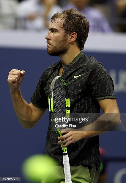 Jerzy Janowicz of Poland reacts against Novak Djokovic of Serbia & Montenegro during his first round Men's Singles match on Day One of the 2016 US...
