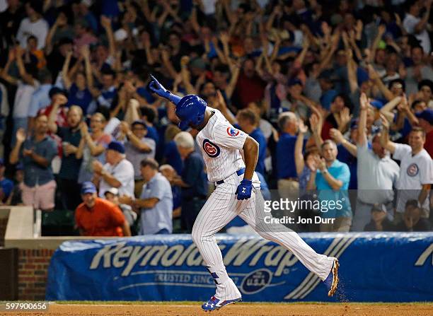 Jorge Soler of the Chicago Cubs celebrates after hitting a home run against the Pittsburgh Pirates during the ninth inning to tie the game at Wrigley...