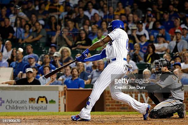 Jorge Soler of the Chicago Cubs hits a home run against the Pittsburgh Pirates during the ninth inning to tie the game at Wrigley Field on August 29,...