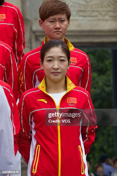 Chinese table tennis player Liu Shiwen and track cyclist Zhong Tianshi pose in front of the Ruins of St. Paul's during their visit to Macau after the...