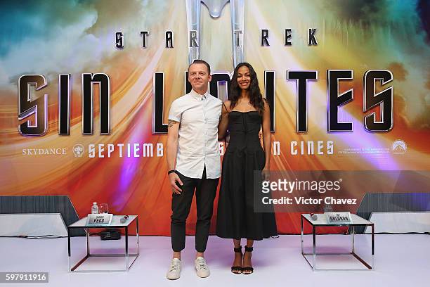 Actor Simon Pegg and actress Zoe Saldana attend a Photocall & Press Conference during the promotional tour of the Paramount Pictures title Star Trek...