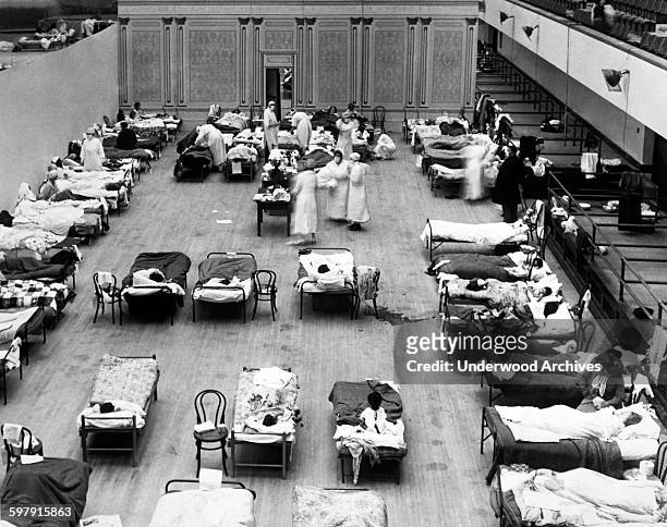 The Oakland Municipal Auditorium is being used as a temporary hospital with volunteer nurses from the American Red Cross tending the sick there...