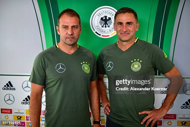 Hansi Flick and Stefan Kuntz, newly unveiled U21 head coach of the German national team, are seen after a press conference at Schlosshotel...