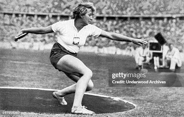 Polish and Jewish athlete Hedwiga Wajsowna throwing the discus at the 1936 Olympics, Berlin, Germany, 1936. She won the silver medal in the event.