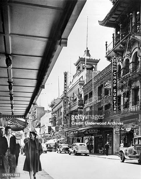 View down Grant Avenue with the 'Noodles Hang Far Low' restaurant, one of Chinatown's most popular, in the center across the street, San Francisco,...