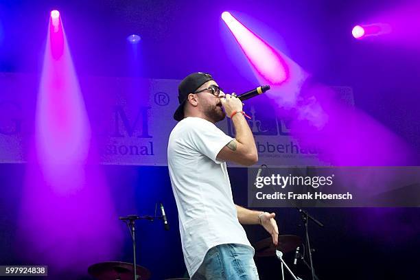 German rapper KC Rebell performs live in support of Kool Savas during a concert at the Zitadelle Spandau on August 26, 2016 in Berlin, Germany.