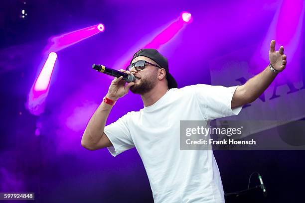 German rapper KC Rebell performs live in support of Kool Savas during a concert at the Zitadelle Spandau on August 26, 2016 in Berlin, Germany.