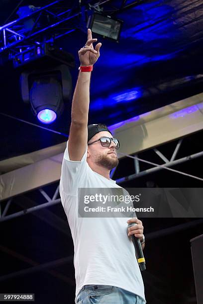 German rapper KC Rebell performs live in support of Kool Savas during a concert at the Zitadelle Spandau on August 26, 2016 in Berlin, Germany.