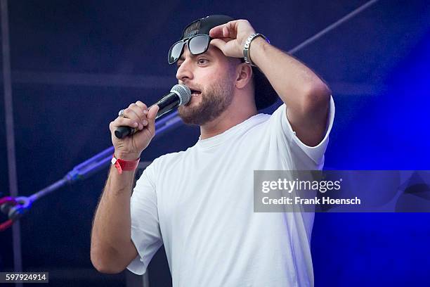 German rapper KC Rebell performs live in support of Kool Savas during a concert at the Zitadelle Spandau on August 26, 2016 in Berlin, Germany.