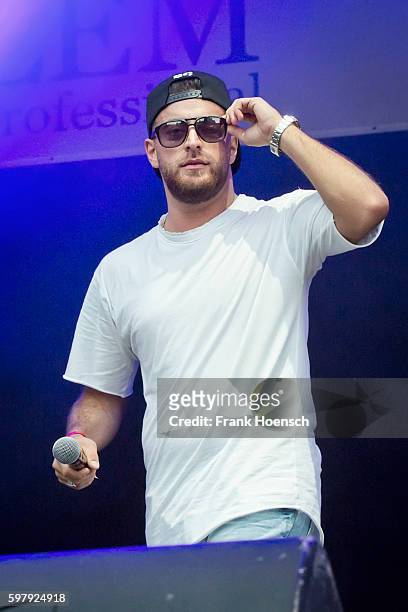 German rapper KC Rebell performs live in support of Kool Savas during a concert at the Zitadelle Spandau on August 26, 2016 in Berlin, Germany.