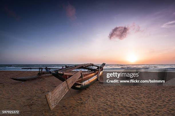 tradiotional fisherboat - negombo stock pictures, royalty-free photos & images