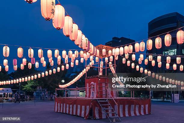 japanese enjoying a traditional dance named obon odori at summer night - 祭り ストックフォトと画像