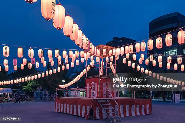 japanese enjoying a traditional dance named obon odori at summer night - paper lantern stock pictures, royalty-free photos & images