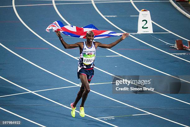 Summer Olympics: Great Britain Mo Farah victorious, holding up Great Britain flag after Men's 5000M Final at Maracana Stadium. Farah wins gold. Rio...