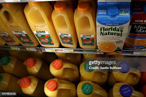 Containers of ready to serve orange juice are displayed in a cooler at a grocery store on August 30, 2016 in San Rafael, California. Demand for ready...