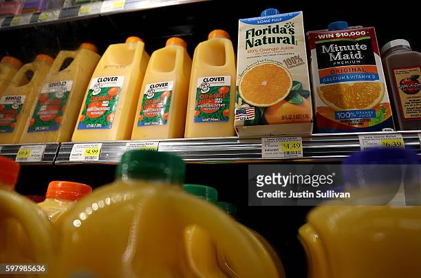 Containers of ready to serve orange juice are displayed in a cooler at a grocery store on August 30, 2016 in San Rafael, California. Demand for ready...