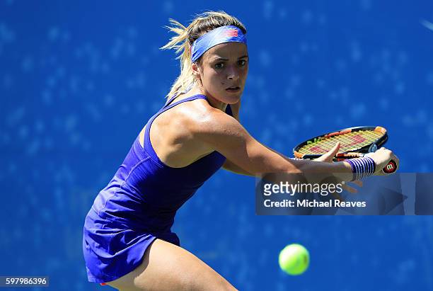 Nicole Gibbs of the United States returns a shot to Aleksandra Krunic of Serbia on Day Two of the 2016 US Open at the USTA Billie Jean King National...