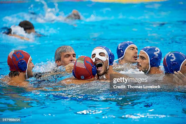 Summer Olympics: Italy Matteo Aicardi victorious with teammates in pool during Men's Bronze Medal match vs Montenegro at Maria Lenk Aquatics Centre....