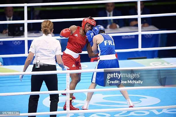 Summer Olympics: France Sarah Ourahmoune in action vs Great Britain Nicola Adams during Women's Fly 51 kg Final at Riocentro Pavillion 6. Adams wins...