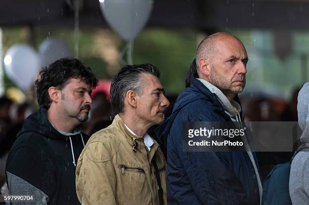 Relatives mourn during a funeral service for victims of the recent earthquake in Amatrice, central Italy, on August 30, 2016.