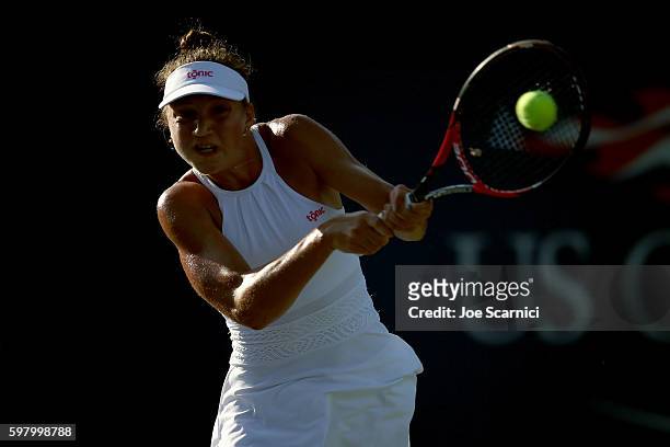 Patricia Maria Tig of Romania returns a shot to Laura Siegemund of Germany during her first round Women's Singles match on Day Two of the 2016 US...