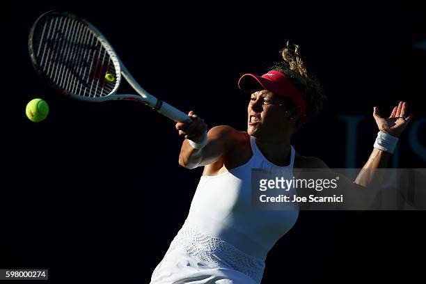 Laura Siegemund of Germany returns a shot to Patricia Maria Tig of Romania during her first round Women's Singles match on Day Two of the 2016 US...