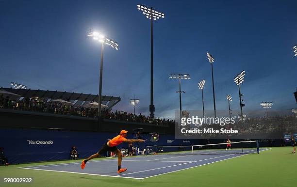 Ivo Karlovic of Croatia returns a shot to Yen-Hsun Lu of Taipei during his first round Men's Singles match on Day Two of the 2016 US Open at the USTA...
