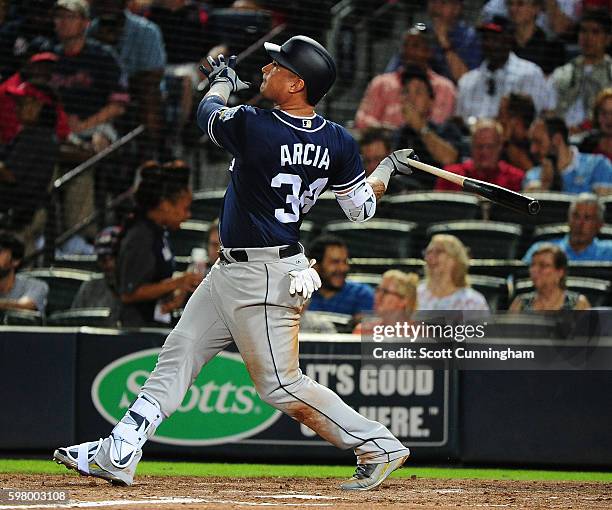 Oswaldo Arcia of the San Diego Padres hits a fourth inning two-run home run against the Atlanta Braves at Turner Field on August 30, 2016 in Atlanta,...