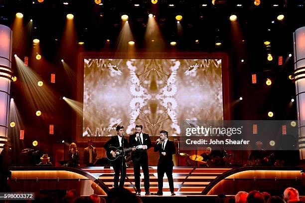 Musical artists Dan Smyers from musical group Dan + Shay, Chris Young and Shay Mooney from musicial group Dan+ Shay perform onstage during the 10th...