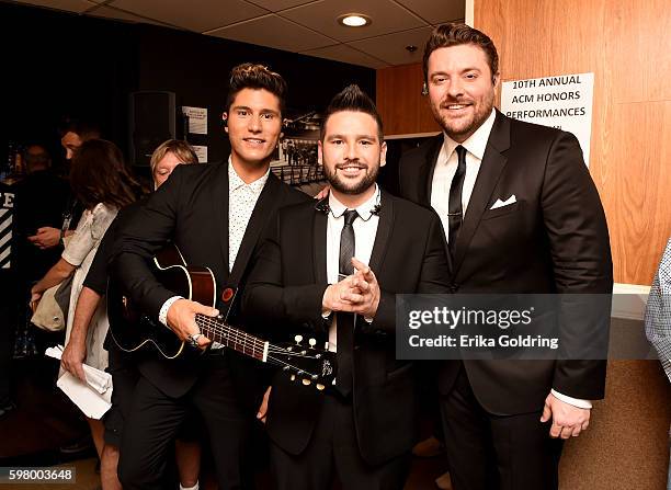 Dan Smyers and Shay Mooney of Dan + Shay pose with Chris Young during the 10th Annual ACM Honors at the Ryman Auditorium on August 30, 2016 in...