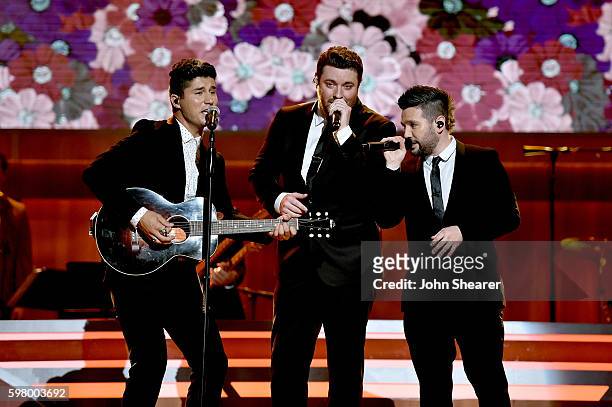 Musical artists Dan Smyers from musical group Dan + Shay, Chris Young and Shay Mooney from musicial group Dan+ Shay perform onstage during the 10th...