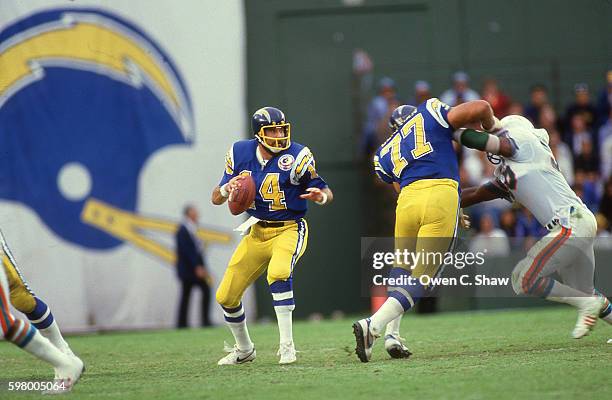 Dan Fouts of the San Diego Chargers circa 1987 dropd back to pass against the Miami Dolphins at Jack Murphy Stadium in San Diego, California.