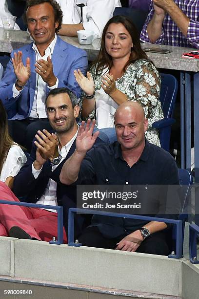 Andre Agassi , Vice President Marco Lavazza and Francesca Lavazza wave to the crowd at the reveal of the LAVAZZA 'I'm Back' campaign at USTA Billie...