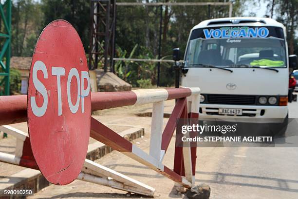 Picture taken on on August 23, 2016 shows a bus parked in Akanyaru on the Rwandan side of the street located at the border with Burundi. "Before, at...