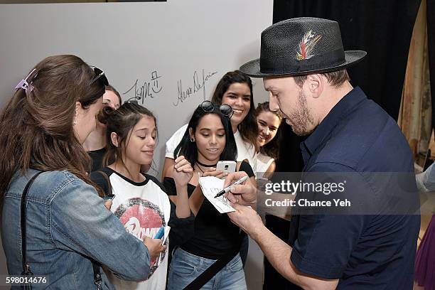 Gavin DeGraw signs autographs for fans at AOL Build's discussion of his new album "Something Worth Saving" at AOL HQ on August 30, 2016 in New York...