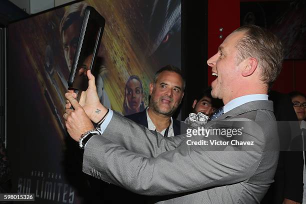 Actor Simon Pegg signs autographs and takes selfies with fans during the promotional tour of the Paramount Pictures title "Star Trek Beyond" at...
